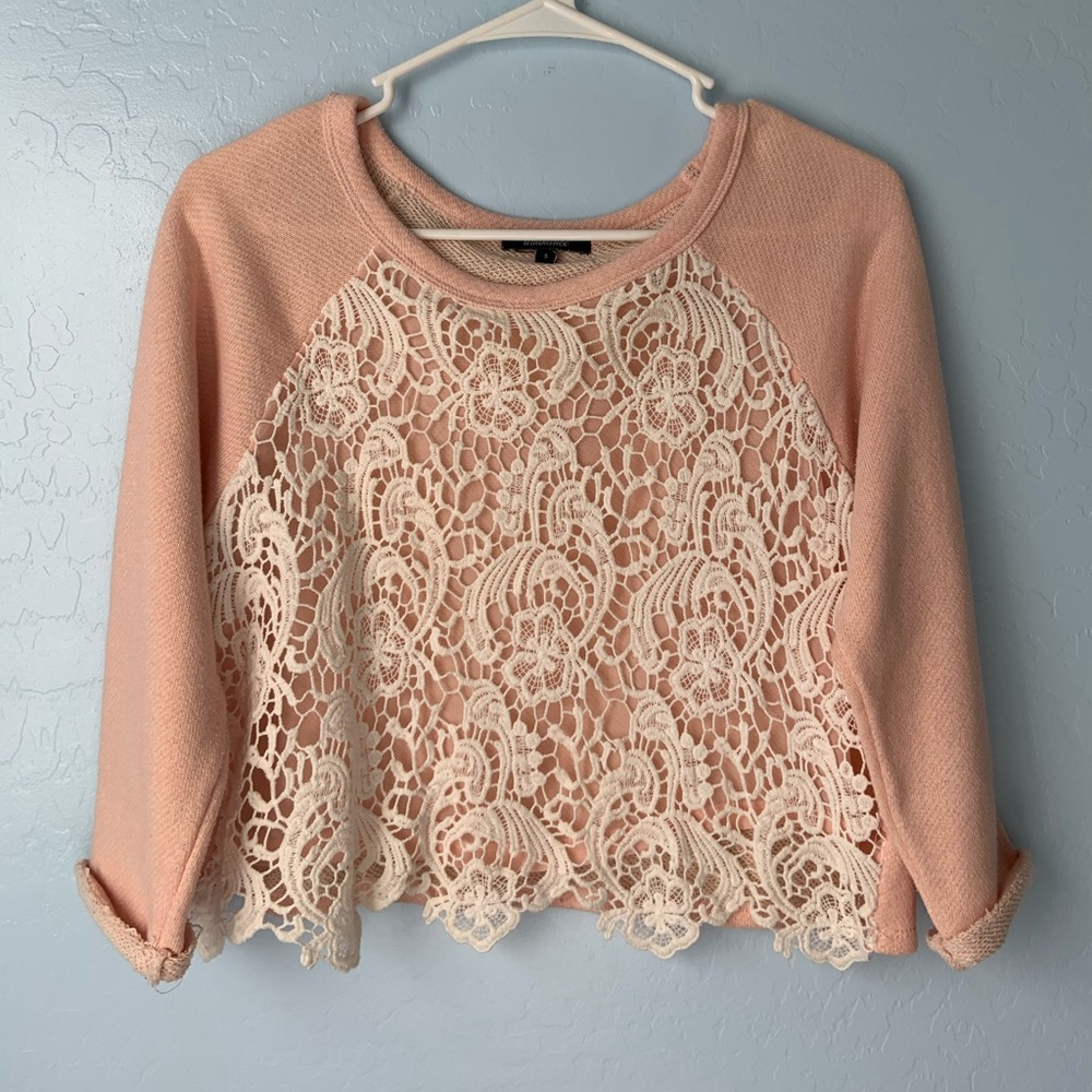 Pink sweater wuth crochet detailing